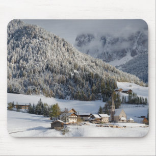 Small alpine village in the snow mousepad