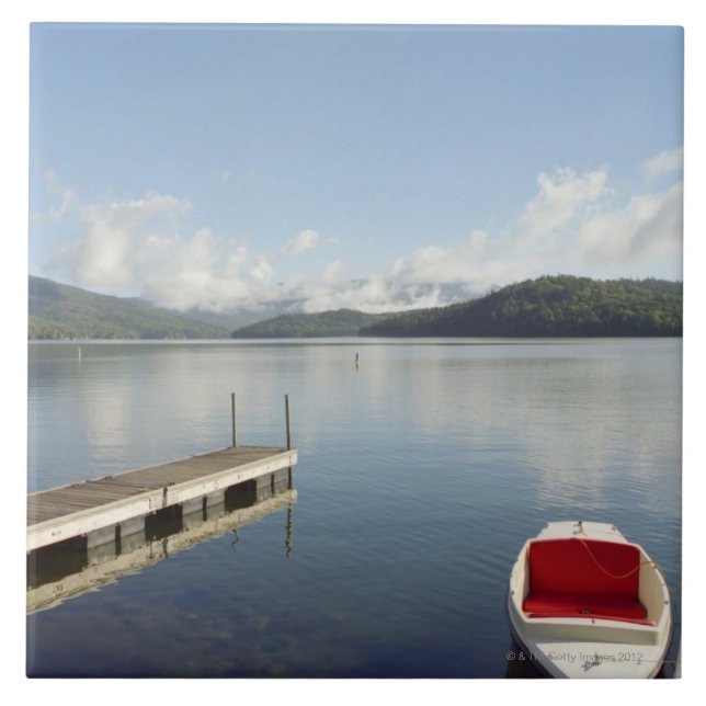 Small boat tied up on dock at Lake Placid Ceramic Tile (Front)