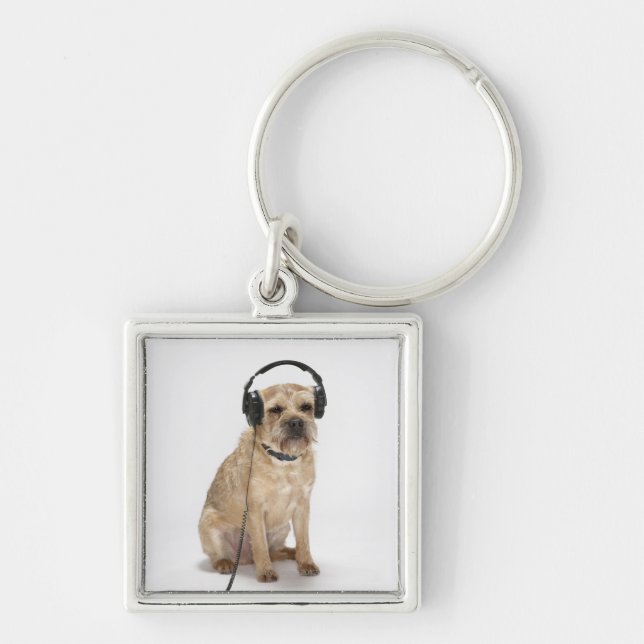 Small dog wearing headphones keychain (Front)