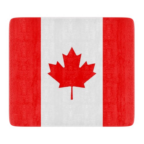 Small glass cutting board with flag of Canada