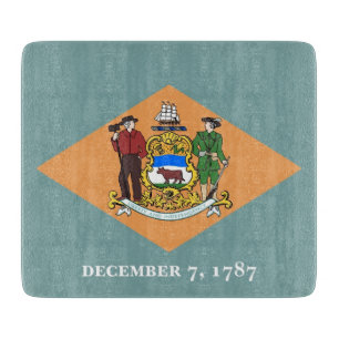 Small glass cutting board with flag of Delaware