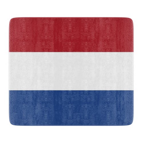 Small glass cutting board with flag of Netherlands