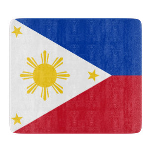 Small glass cutting board with flag of Philippines
