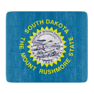 Small glass cutting board with South Dakota flag