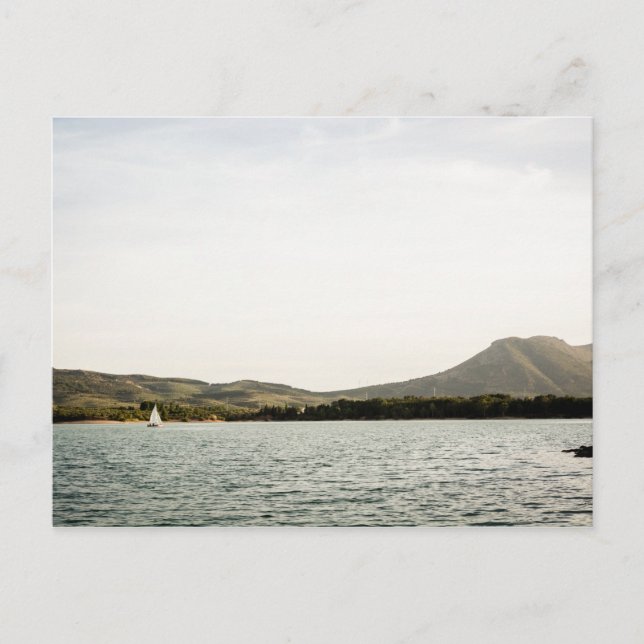 Small ship sailing on a lake at the afternoon postcard (Front)