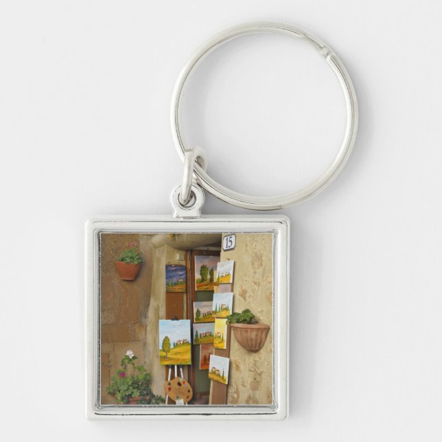 Small shope with artwork for sale on sidewalk keychain (Front)