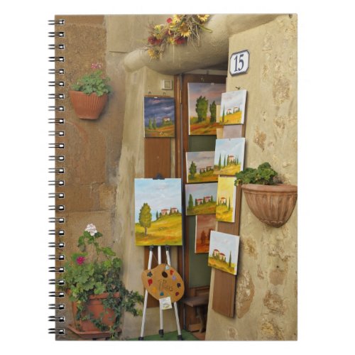 Small shope with artwork for sale on sidewalk notebook