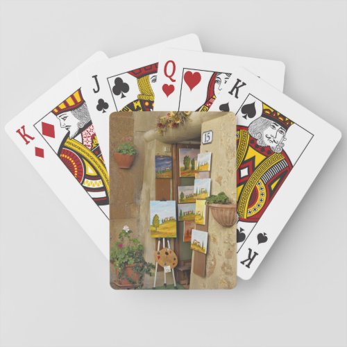 Small shope with artwork for sale on sidewalk poker cards