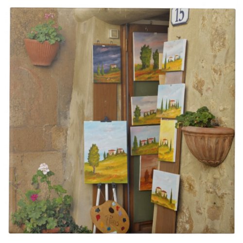 Small shope with artwork for sale on sidewalk tile