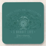 Small Steps, Big Adventures - A Hobbit Life Beverage Coaster<br><div class="desc">Channel your inner Hobbit with this cozy Lord of the Rings™ design inspired by the peaceful hills of the Shire™. Featuring a quaint Hobbit hole with its signature round door tucked into a lush, grassy hillside, the artwork is paired with the uplifting phrase, “Small Steps Big Adventures – A Hobbit...</div>