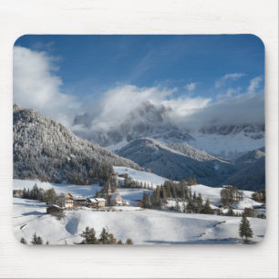 Small village with Dolomites mountains in the snow Mouse Pad