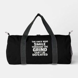 Smile grind gym motivation quote with white text duffle bag