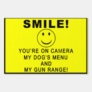 SMILE! No tresspassing sign