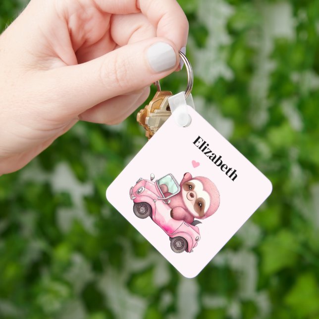Smiling Pink Sloth Driving a Convertible Keychain (Hand)