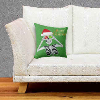 Smiling Skeleton Holding Ornaments to Eyes Green Throw Pillow