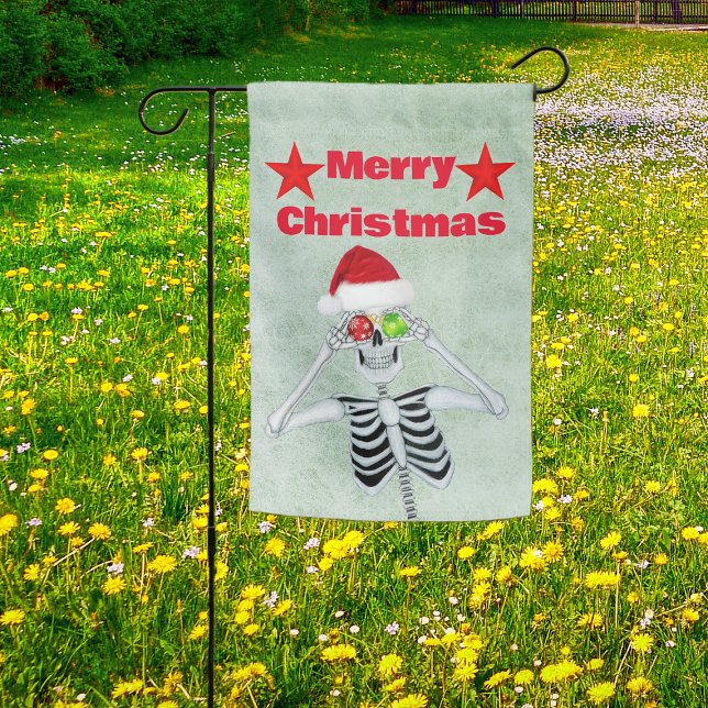 Smiling Skeleton Ornaments Santa Hat Stars Green Garden Flag (Merry Christmas skeleton ornament eyes, red stars, Santa hat on garden Christmas decoration flag.)