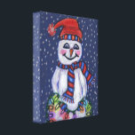 Smiling Snowman Holding Christmas Lights Snow Canvas Print<br><div class="desc">This gallery wrapped canvas art print has a smiling snowman wearing a red and blue knit hat and scarf holding a string of bright lit Christmas lights with falling snow on a dark blue background.</div>