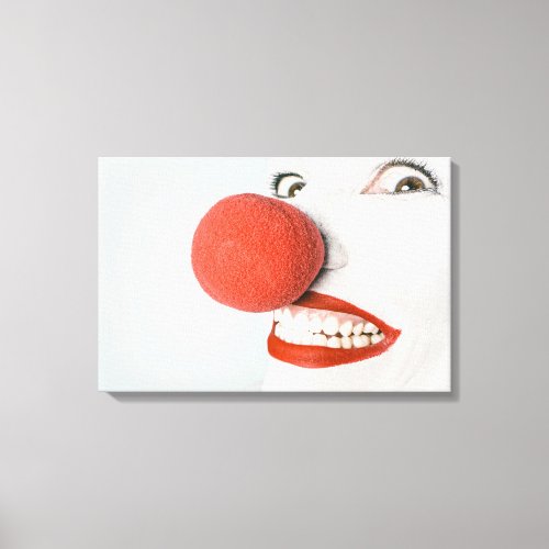 Smiling woman clown with a big red nose canvas print