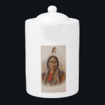 Smoke Signals: Lakota Indian Chief Sitting Bull Teapot<br><div class="desc">In the swirling smoke of a bygone era, a weathered card tells a tale. On its surface, a stoic visage; Sitting Bull, the legendary Lakota chief, his gaze piercing through time. But this is no ordinary portrait. It's a cigarette card, a sliver of history tucked between puffs of tobacco. ---...</div>