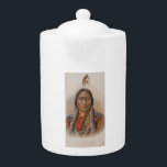 Smoke Signals: Lakota Indian Chief Sitting Bull Teapot<br><div class="desc">In the swirling smoke of a bygone era, a weathered card tells a tale. On its surface, a stoic visage; Sitting Bull, the legendary Lakota chief, his gaze piercing through time. But this is no ordinary portrait. It's a cigarette card, a sliver of history tucked between puffs of tobacco. ---...</div>