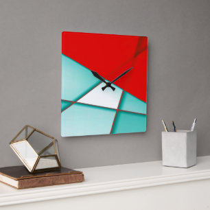 Smooth turcoise trapeze rectangle under red sheet square wall clock