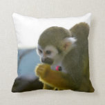 Snacking Squirrel Monkey Throw Pillow