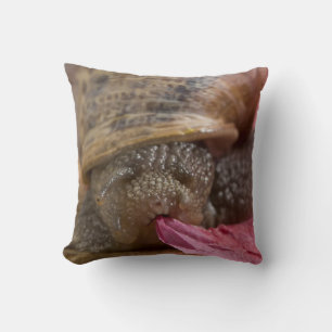 Snail eating pink paper bizarre snail throw pillow
