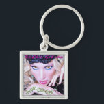 Snake Charmer Key Chain<br><div class="desc">You know if it was 1989,  you'd be begging your parents to drive you to the mall and get one for you and your best friend! Celebrating Debbie's song from 2011's Mega Python VS Gatoroid,  this key chain features the cover art from her single "Snake Charmer".</div>