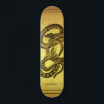 Snakes Personalized Faux Gold Foil Skateboard<br><div class="desc">A unique skateboard featuring two snakes entangled and your name personalized in a script signature on a faux gold foil background. eye catching and bold.</div>