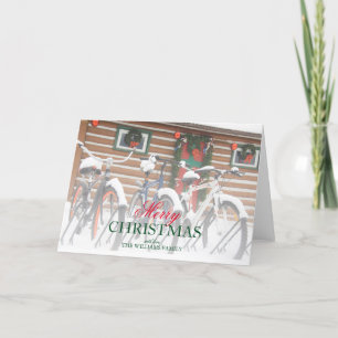 Snow-Covered Bicycles Near Festive Lodge Holiday Card