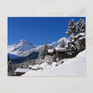 Snow-covered log cabins in Switzerland Postcard