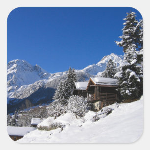 Snow-covered log cabins in Switzerland Square Sticker