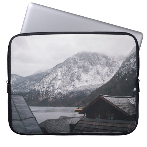 SNOW-COVERED MOUNTAIN NEAR BODY OF WATER LAPTOP SLEEVE