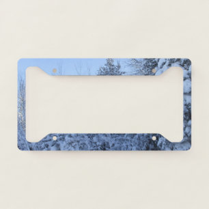 Snow Covered Pine trees and Bare Trees License Plate Frame