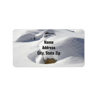 Snow Drifts Over Rocks Label