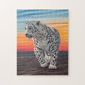 Snow Leopard Walking on the Beach During a Sunset