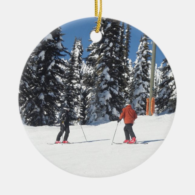 Snow Scene with Skiers and Snow Covered Trees Ceramic Ornament (Front)