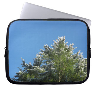 Snow-tipped Pine Tree on Blue Sky Laptop Sleeve