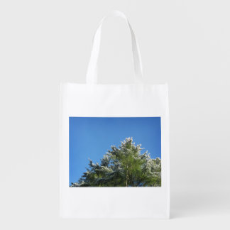 Snow-tipped Pine Tree on Blue Sky Reusable Grocery Bag