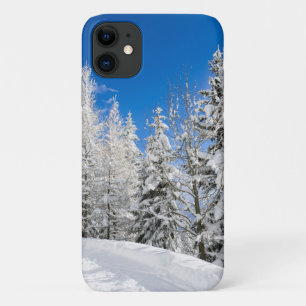 Snow trees under a clear blue sky iPhone 11 case