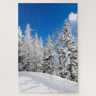 Snow trees under a clear blue sky in winter jigsaw puzzle