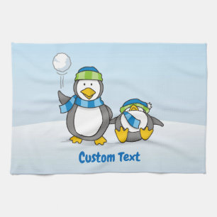 Snowballing penguins kitchen towel