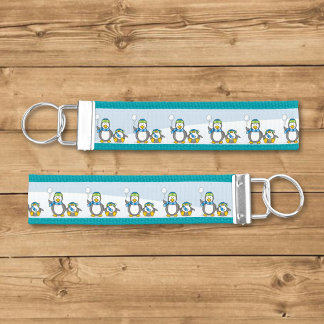Snowballing penguins wrist keychain