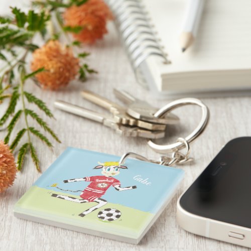 Snowbell the cow playing soccer name keychain