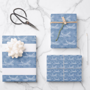 Snowflake Airplane on blue. Wrapping Paper Sheets