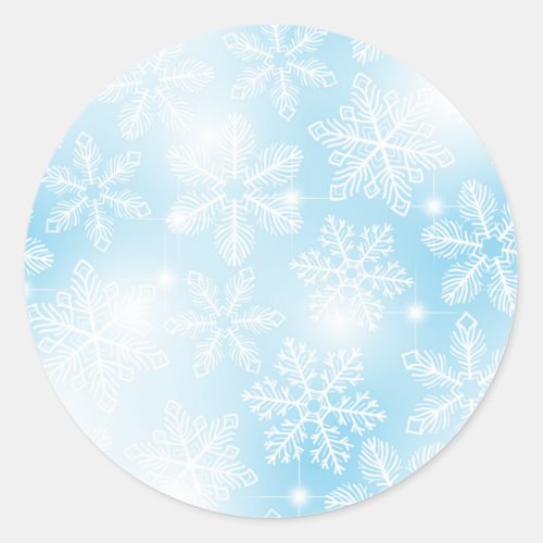 Snowflakes and lights on blue classic round sticker