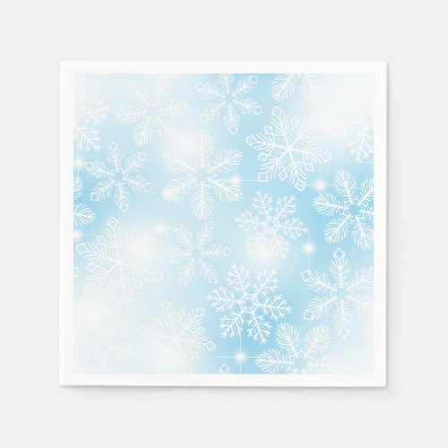 Snowflakes and lights on blue napkins