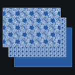 Snowflakes and Stars Wrapping Paper Sheets<br><div class="desc">Holiday gift wrap featuring snowflakes and stars on blue.</div>