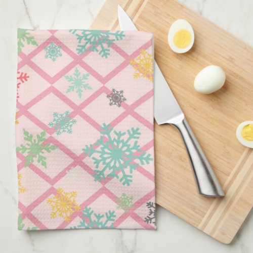 Snowflakes on a pink background with trellis kitchen towel