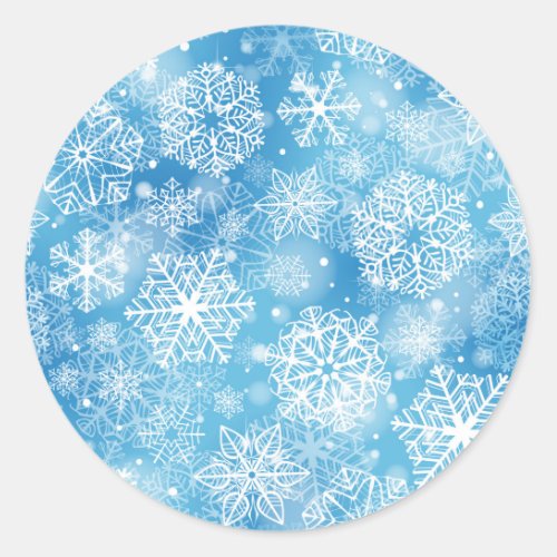 Snowflakes on blue classic round sticker